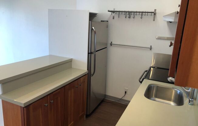 Top Floor Remodeled rent controlled apartment w/ parking, storage and water, garbage and laundry included.