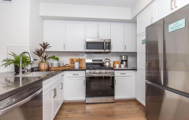 a kitchen with a stove and a refrigerator