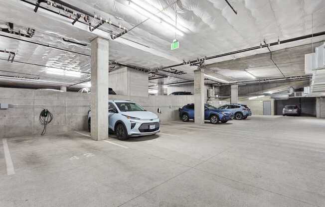 parking spaces in a parking garage with cars