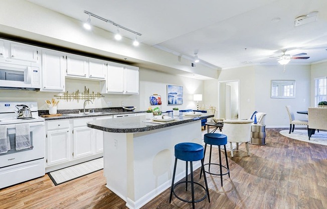 a kitchen with a bar and a living room