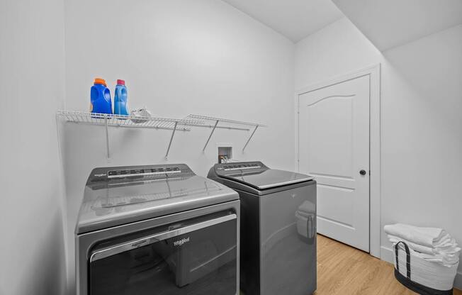 A laundry room with a washer and dryer.