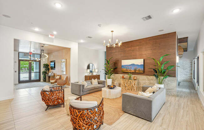 a living room with couches and chairs