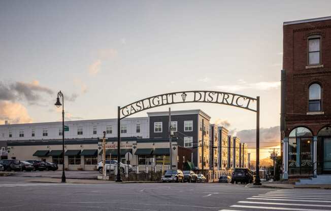 a city street with a large sign on top of a building