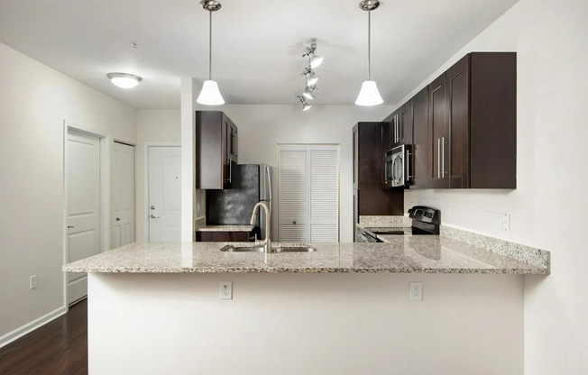 View of Kitchen at Marq Highland Park Apartments