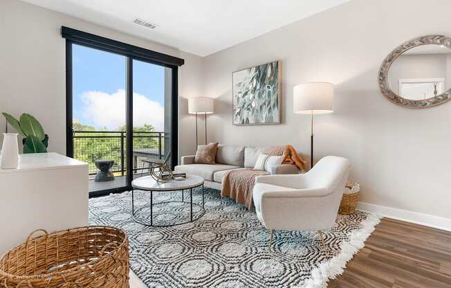 a living room with a large window and a balcony