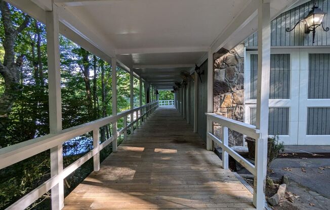 Unique Lake Lanier front home w/spectacular natural rock waterfall and dock