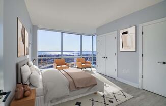 3thirty3 new rochelle ny apartment high rise photo of bedroom with large windows and modern furnishings