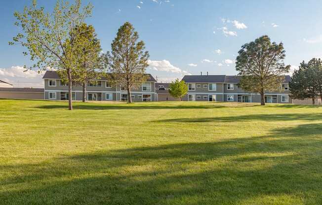 a view of an open field in front of an apartment building at Shiloh Glen, Billings, MT