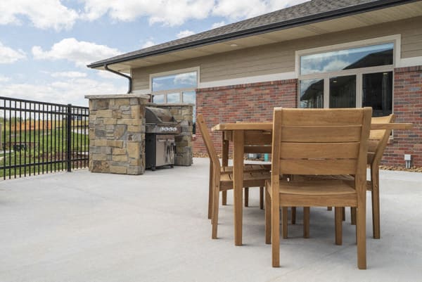 Outdoor table with grill at The Villas at Falling Waters in west Omaha