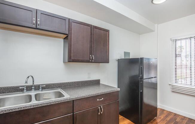 a kitchen with a sink and a window