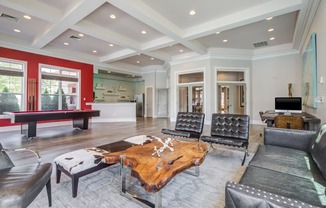 clubhouse lounge area with billiards table in the background