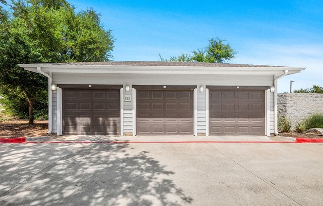 a parking lot with two garage doors