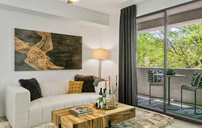 a living room with a white couch and a coffee table
