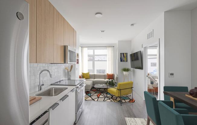 a kitchen and living room in a small apartment