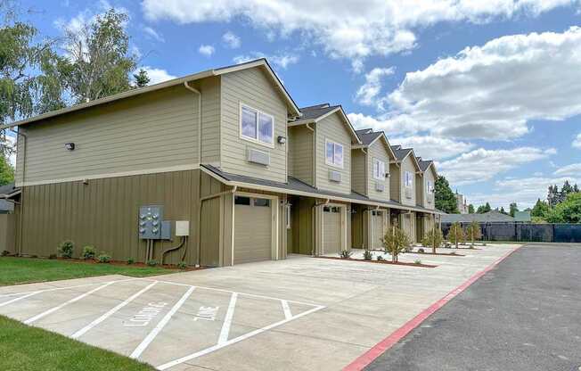 a row of houses with a parking lot