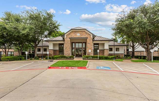 A building with a parking lot in front of it.