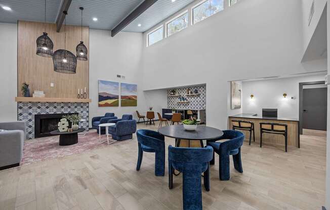 A modern living room with a fireplace and a dining table.