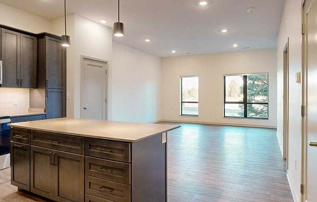 a view of a spacious living room from a kitchen island countertop