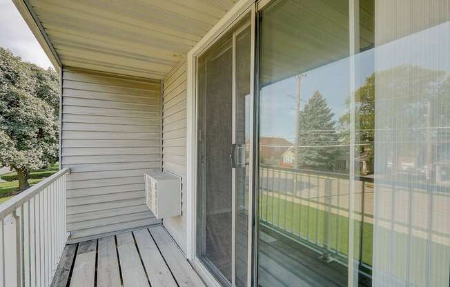 a sliding glass door on a porch of a home