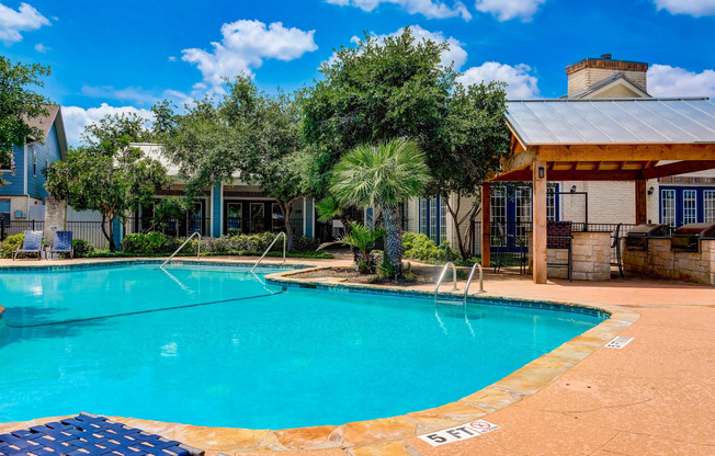 Community pool with outdoor kitchen and BBQ pavilion
