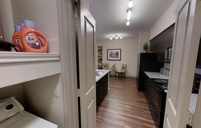 a kitchen with a sink and a mirror