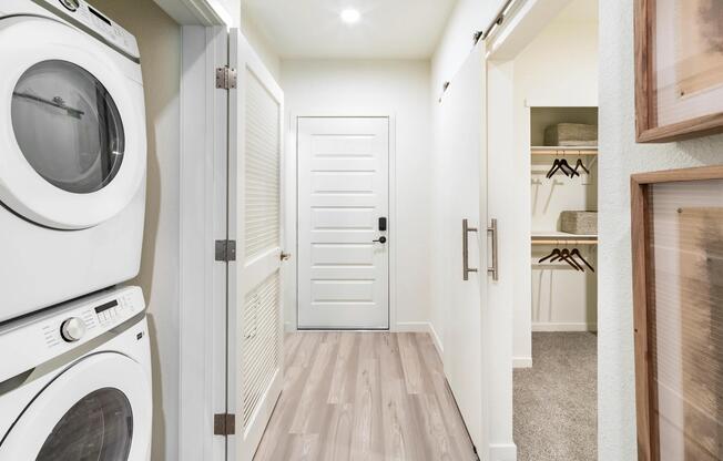 In-home laundry and a spacious closet at Modera University Park, thoughtfully designed to streamline daily routines and storage needs.