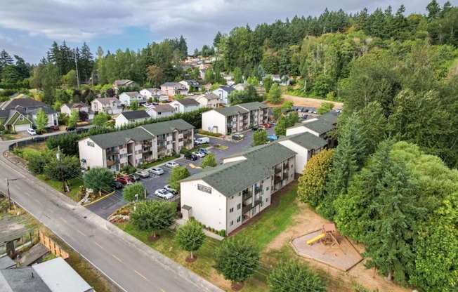 an aerial view of a neighborhood with houses and trees  at Sitka Heights, Fife, WA, 98424