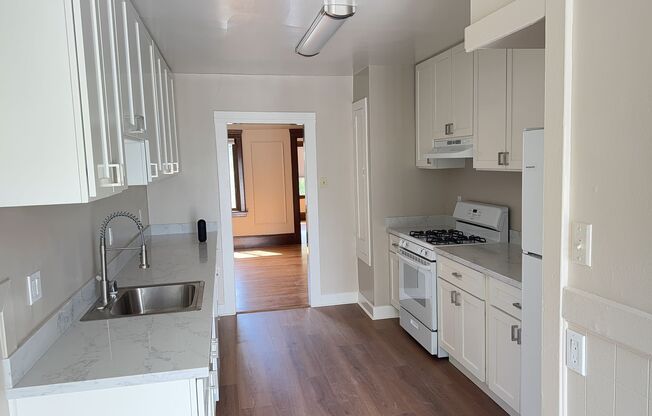 Bright Sunnyside Home with Fireplace, Bay Windows & Private Backyard!