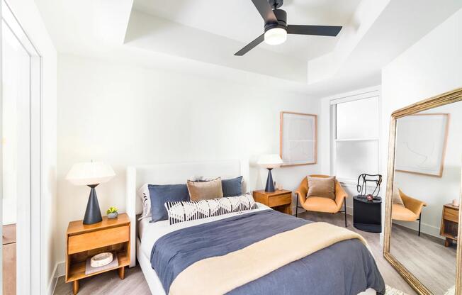 Retreat to a light-filled bedroom at Modera St. Paul, where clean design and inviting details create a calming escape in the center of Dallas.