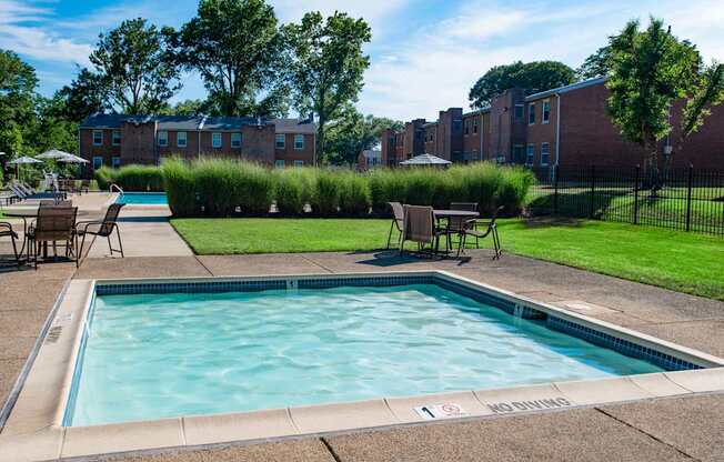 our apartments have a resort style pool and lounge chairs