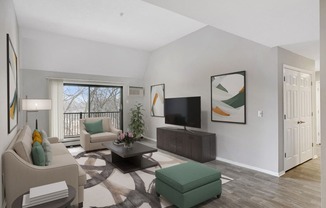 Stratford Wood Apartments and Townhomes in Minnetonka, MN Photo of the living room of an apartment with couches and a tv