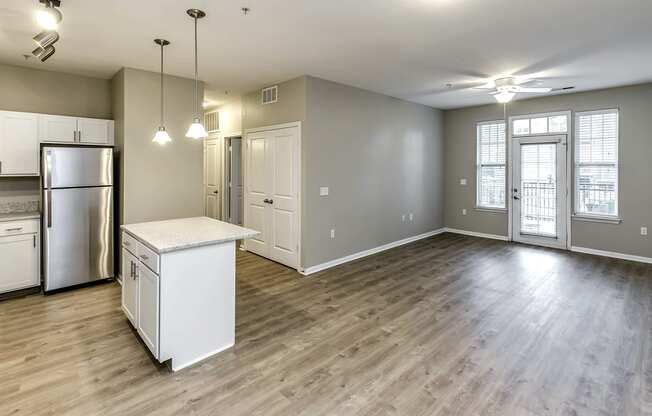 Large Living Room with sophisticated light fixtures at Legacy Commons Apartments in Omaha, NE