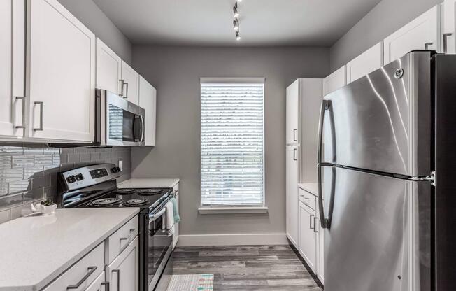 a stainless steel refrigerator in a kitchen