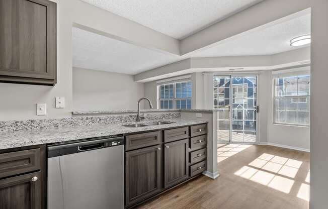 Kitchen with Dark Brown Cabinetry and Stainless Steel Appliances