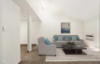 a living room with white walls and a brown rug at Park View Apartments, Wenatchee, WA