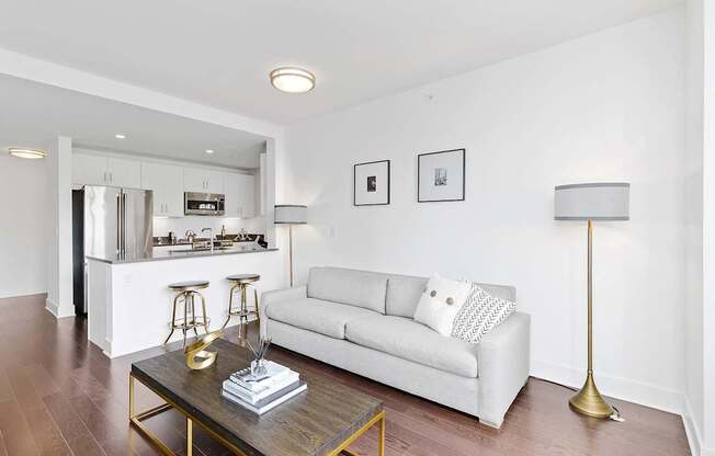 Living room with white couch and table at 65 Bay Street, Jersey City, 07302