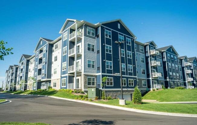 A large apartment complex with multiple buildings and balconies.