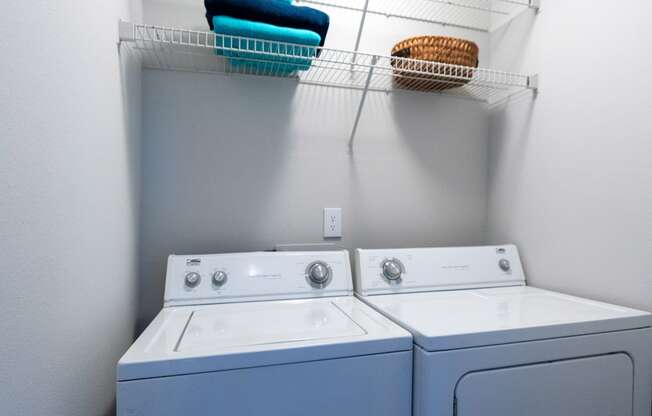 the washer and dryer in the laundry room of a home