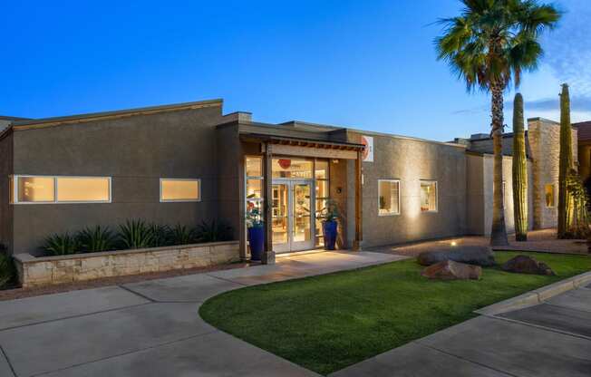 a building with a palm tree in front of it
