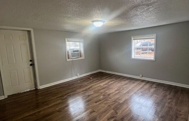 Charming 2BR Home with Large Front Porch & Spacious Kitchen