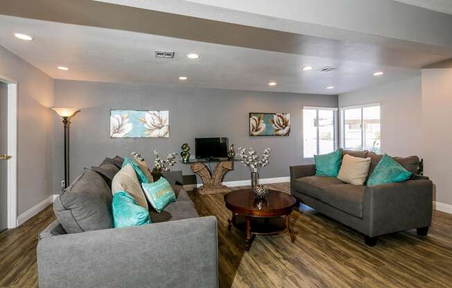 a living room with couches and a coffee table at Sunset Winds Apartments, Nevada, 89014