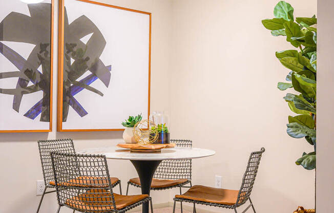 a dining room with a table and chairs at Atria at Crabtree Valley, NC 27612