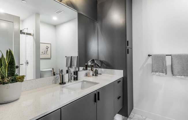 a bathroom with a sink and a shower and a mirror at The Commonwealth Building, Pennsylvania