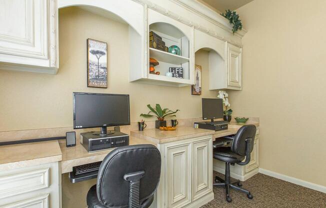 The Avenueâs business center with two desks and two computersÂ 