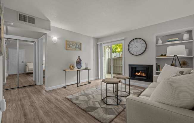 a living room with a couch and a fireplace