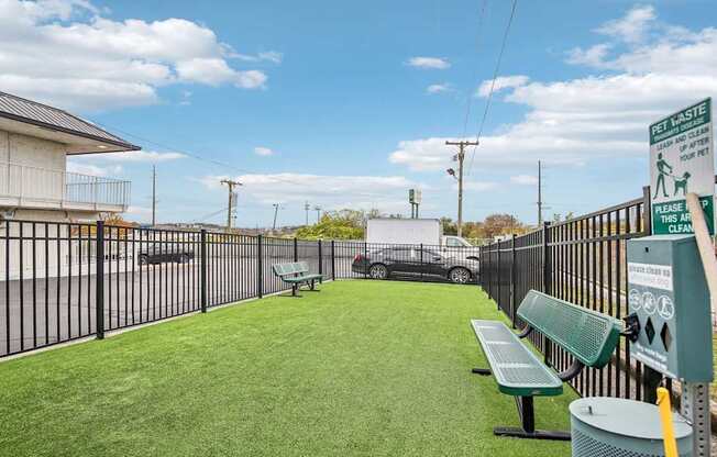 A sign on a fence reads