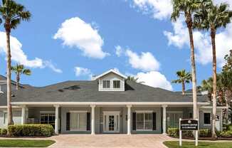 A house with a sign that says "Welcome" in front of it.