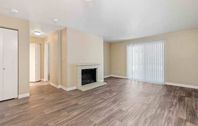Saratoga Apartments in Everett, Washington Living Room with Fireplace and Private Patio