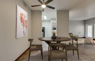 Model Dining Room with Wood-Style Flooring at Landings at Morrison Apartments located in Gresham, OR.