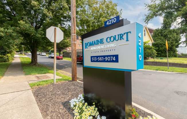 This is a photo of the entrance sign at Romaine Court Apartments in the Oakley neighborhood of Cincinnati, Ohio.